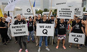 QAnon protestors against restrictions in Romania
